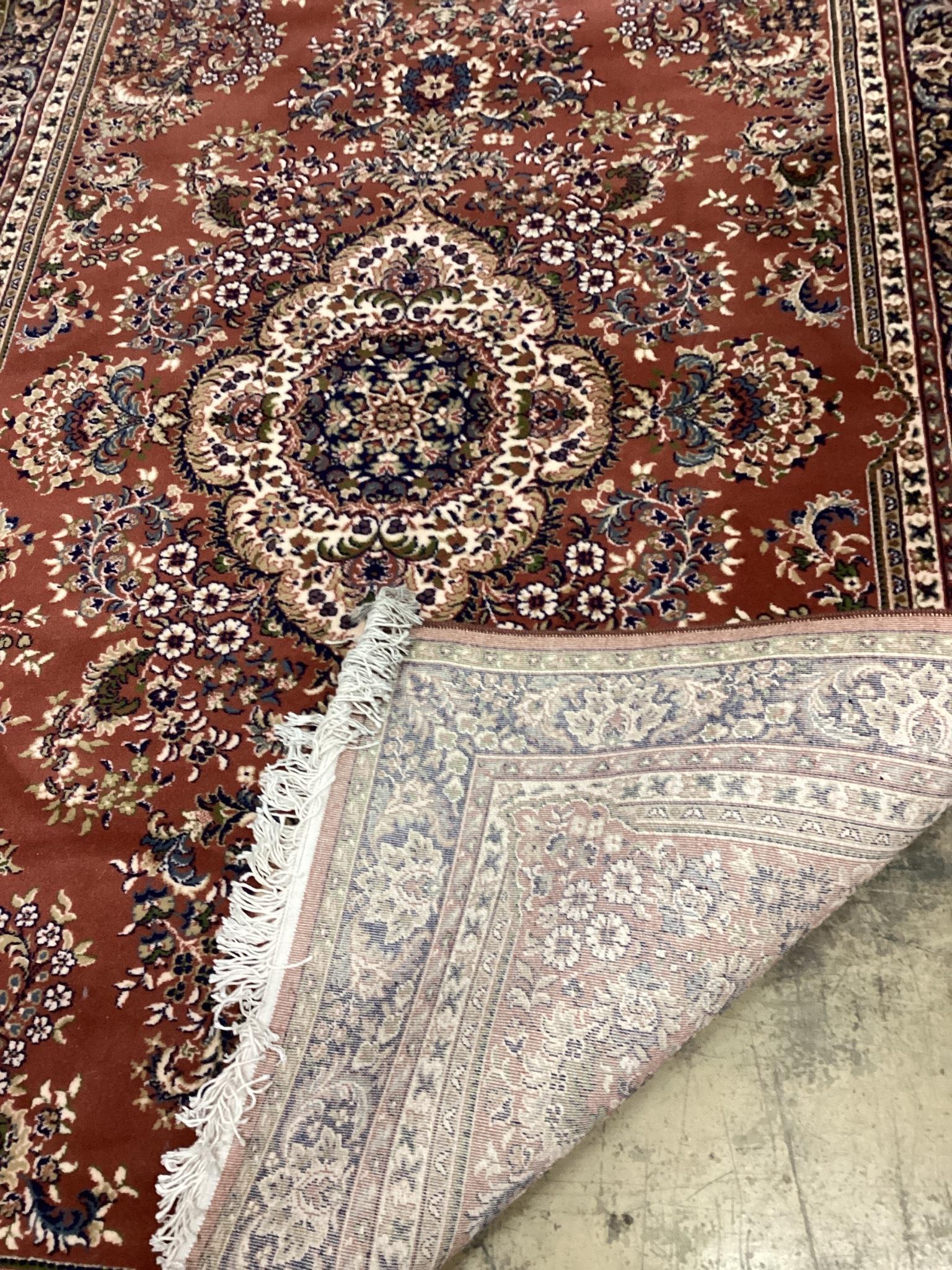 A modern Tabriz style red ground rug, 240 x 162cm